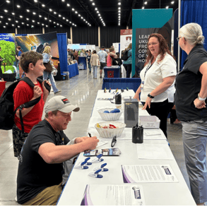 Liberty HealthShare employees share the good news of healthcare sharing with attendees of the Teach…