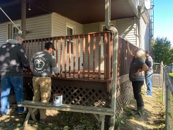 Liberty HealthShare employees volunteering at a neighborhood clean up.