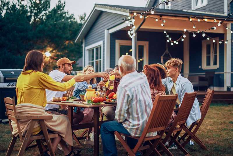 Liberty Unite photo of large family eating outside during sunset