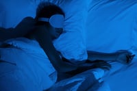 woman setting a nighttime routine to combat signs of sleep deprivation