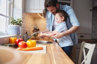 child washing hands and vegetables as back to school tips for preschool parents