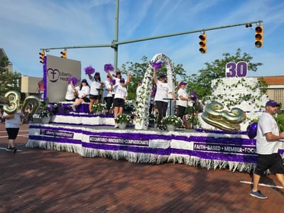 Liberty HealthShare employees participate in the 2025 Pro Football Hall of Fame Grand Parade to cele…