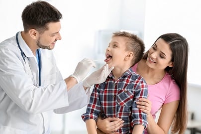 primary care doctor treating child