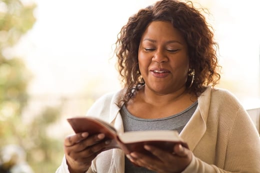 person reading a book and thinking about how words matter during times of fear and depression, understanding salvation lies through god