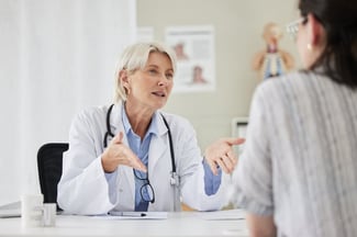 doctor explaining relationship between healthy weight and cardiovascular disease for an early heart attack among other risk factors