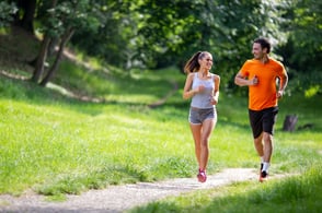 happy young fit people running together ourdoors.