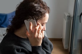 woman calling a clinic in advance to confirm address before speaking to someone regarding advice on seeking a primary care physician