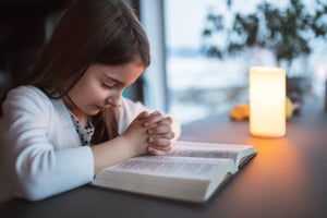 child reading Bible analysis online about how human beings, whom in the beginning God created in his own image, can be a good steward in the eye of our Lord Christ 