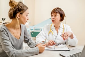 woman talking to doctor