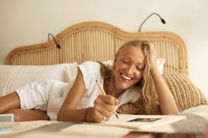 woman happy writing