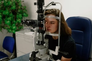 young woman receiving eye exam | Liberty Vision