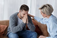 a woman offering a man a prayer for strength and encouragement